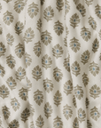 Fabric with a leaf pattern on a beige background