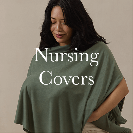 A mother drapes a beautifully flowing, deep green Solly Baby nursing cover for a breathable and stylish feeding experience. Shop Nursing Covers.