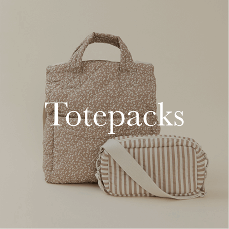 A matching totepack and zippered pouch in a cozy, textured fabric rest against a neutral background, designed for stylish and practical on-the-go moments. Shop Totepacks.