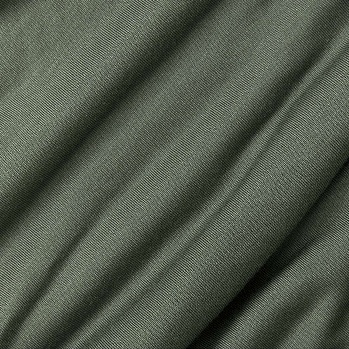 Close-up of green fabric with a subtle pattern