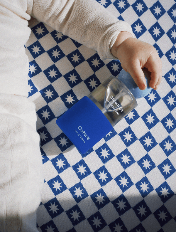 Coterie dream oil on blue and white checkered starred background.