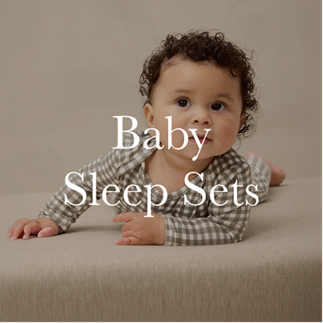 Baby lying on a beige surface with text 'Baby Sleep Sets' on a brown background