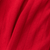 Close-up of red fabric with visible pointelle texture