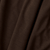 A close-up of dark brown textured fabric with soft folds and a fine woven pattern.