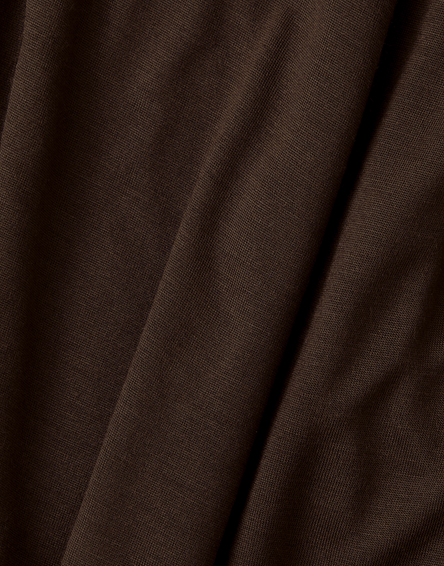 A close-up of dark brown textured fabric with soft folds and a fine woven pattern.