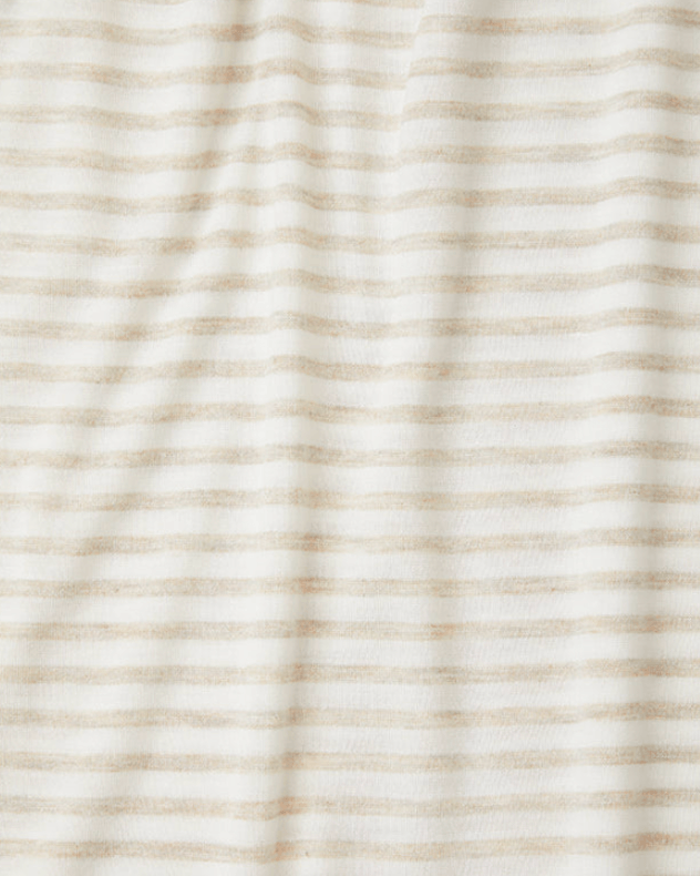 A close-up of a striped fabric with thin, horizontal tan or light beige stripes on an off-white background.