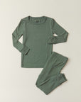 A two-piece long-sleeve pajama set in a muted sage green color, laid flat on a light beige background. The set includes a crewneck top and matching pants.